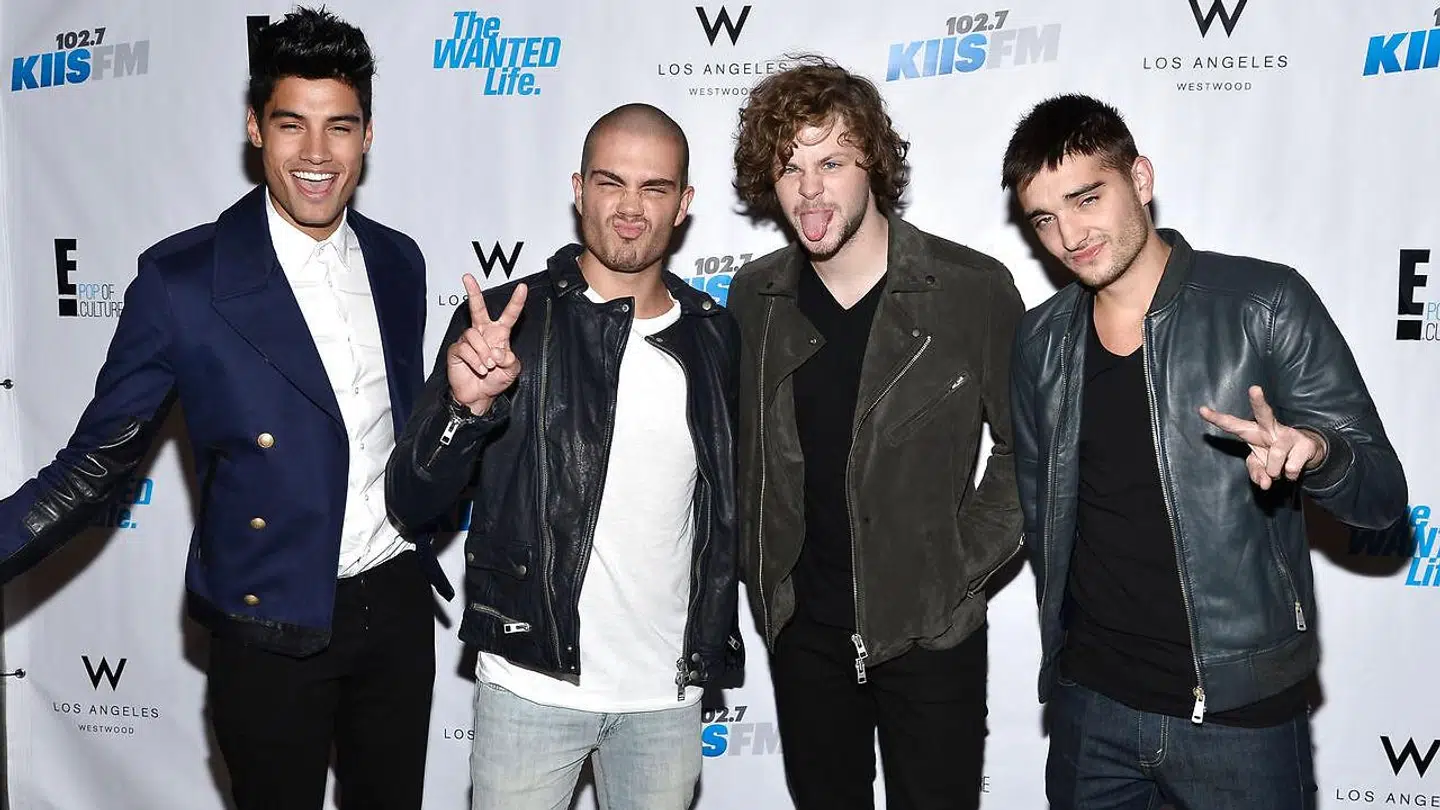 Helt til højre Tom Parker. Til venstre for ham står resten af det britiske boyband The Wanted.