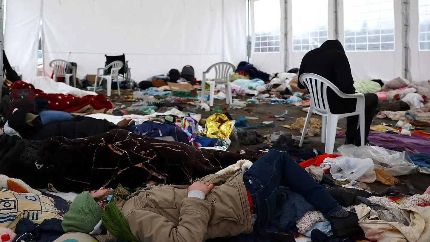 Refugees rest in a tent, after fleeing from Ukraine following the Russian invasion, at the border checkpoint in Medyka, Poland, March 2, 2022. REUTERS/Kai Pfaffenbach