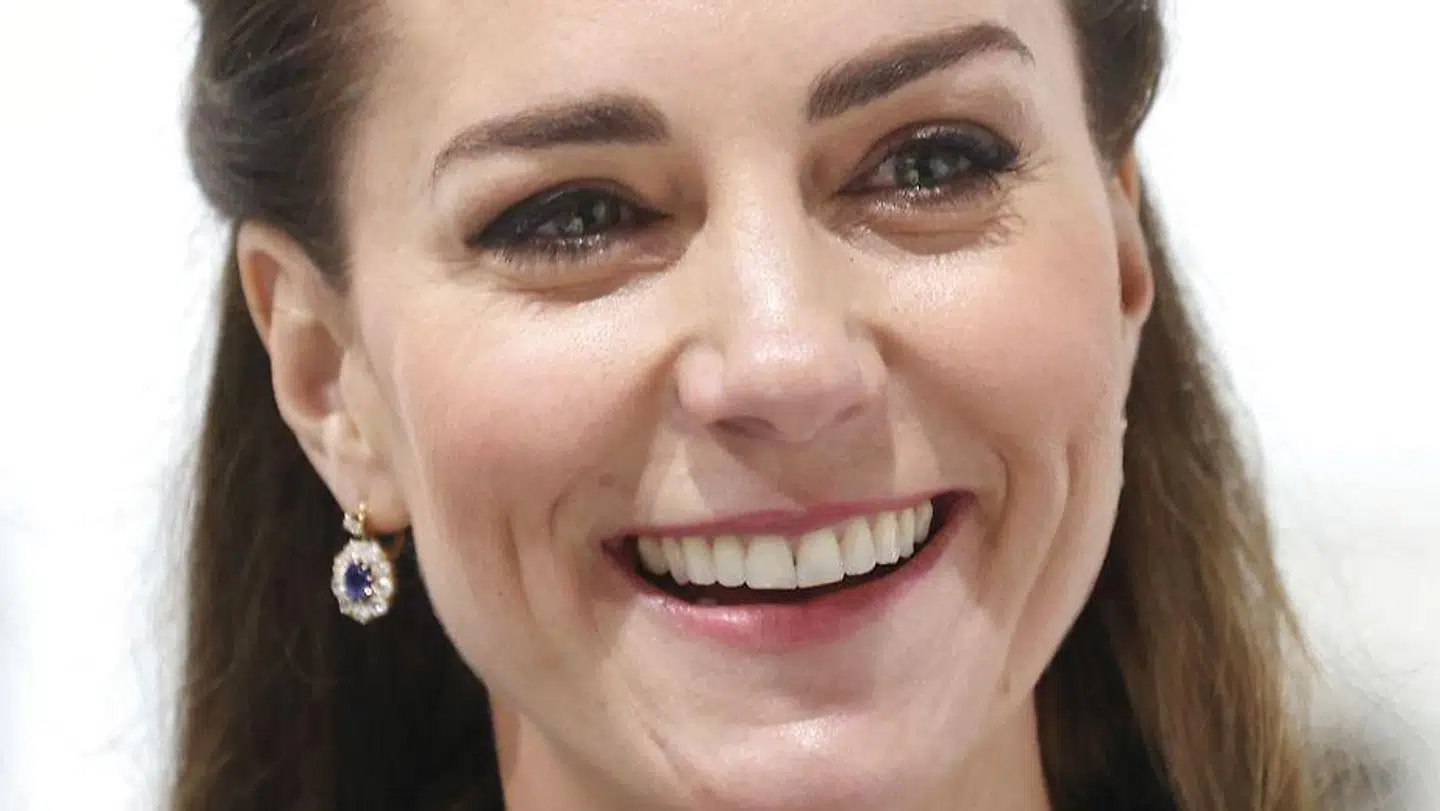 Britain's Catherine, Duchess of Cambridge, reacts during her visit to The Prince's Foundation's 'Trinity Buoy Wharf' training site for arts and culture, in east London on February 3, 2022. - Trinity Buoy Wharf is a creative quarter located on the banks of the River Thames, opposite the O2 Arena, in the Tower Hamlets area of East London. The Foundation have established a base at Trinity Buoy Wharf, where it runs courses for all ages in traditional building skills such as thatching, blacksmithing and stonemasonry as well as associated skills such as geometry and sculpting. (Photo by Chris Jackson / POOL / AFP)