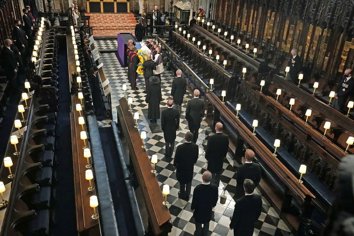 Members of the Royal Family stand behind the coffin of Britain's Prince Philip, husband of Queen Elizabeth, who died at the age of 99, during his funeral at St George's Chapel, in Windsor, Britain, April 17, 2021. Yui Mok/Pool via REUTERS