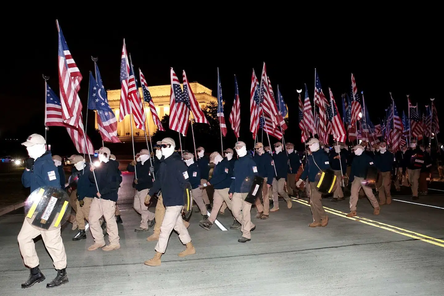 WASHINGTON, DC - DECEMBER 04: Members of the rightwing group Patriot Front gather for an unannounced rally at the National Mall on December 04, 2021 in Washington, DC. Patriot Front broke off of the white nationalist group Vanguard America after the deadly "Unite the Right" rally in Charlottesville, Virginia in 2017. Win McNamee/Getty Images/AFP == FOR NEWSPAPERS, INTERNET, TELCOS & TELEVISION USE ONLY ==