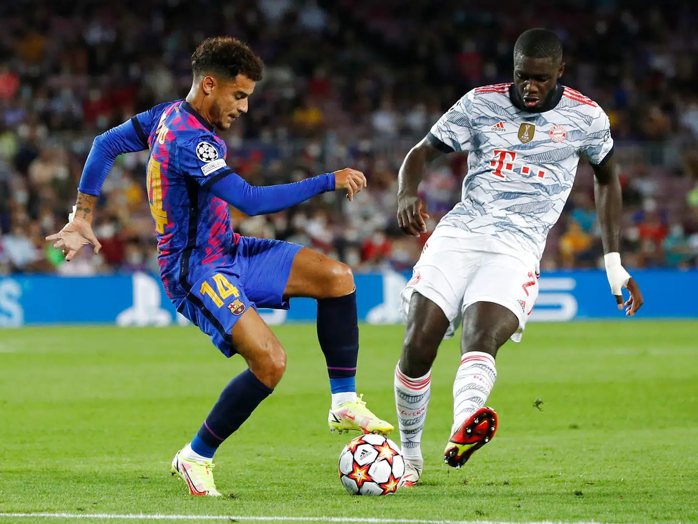 Soccer Football - Champions League - Group E - FC Barcelona vs Bayern Munich - Camp Nou, Barcelona, Spain - September 14, 2021 FC Barcelona's Philippe Coutinho in action with Bayern Munich's Dayot Upamecano REUTERS/Albert Gea