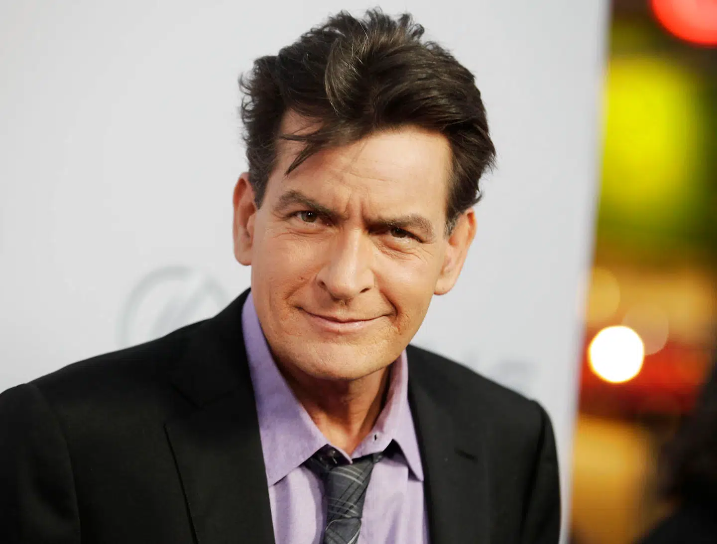 Cast member Charlie Sheen poses at the premiere of his new film "Scary Movie 5" in Hollywood, in this file photo taken April 11, 2013. Celebrity website RadarOnline.com and the National Enquirer tabloid on April 7, 2016 refused to hand over material sought by authorities investigating threats that those media reported actor Charlie Sheen had made against a former girlfriend. REUTERS/Fred Prouser/Files