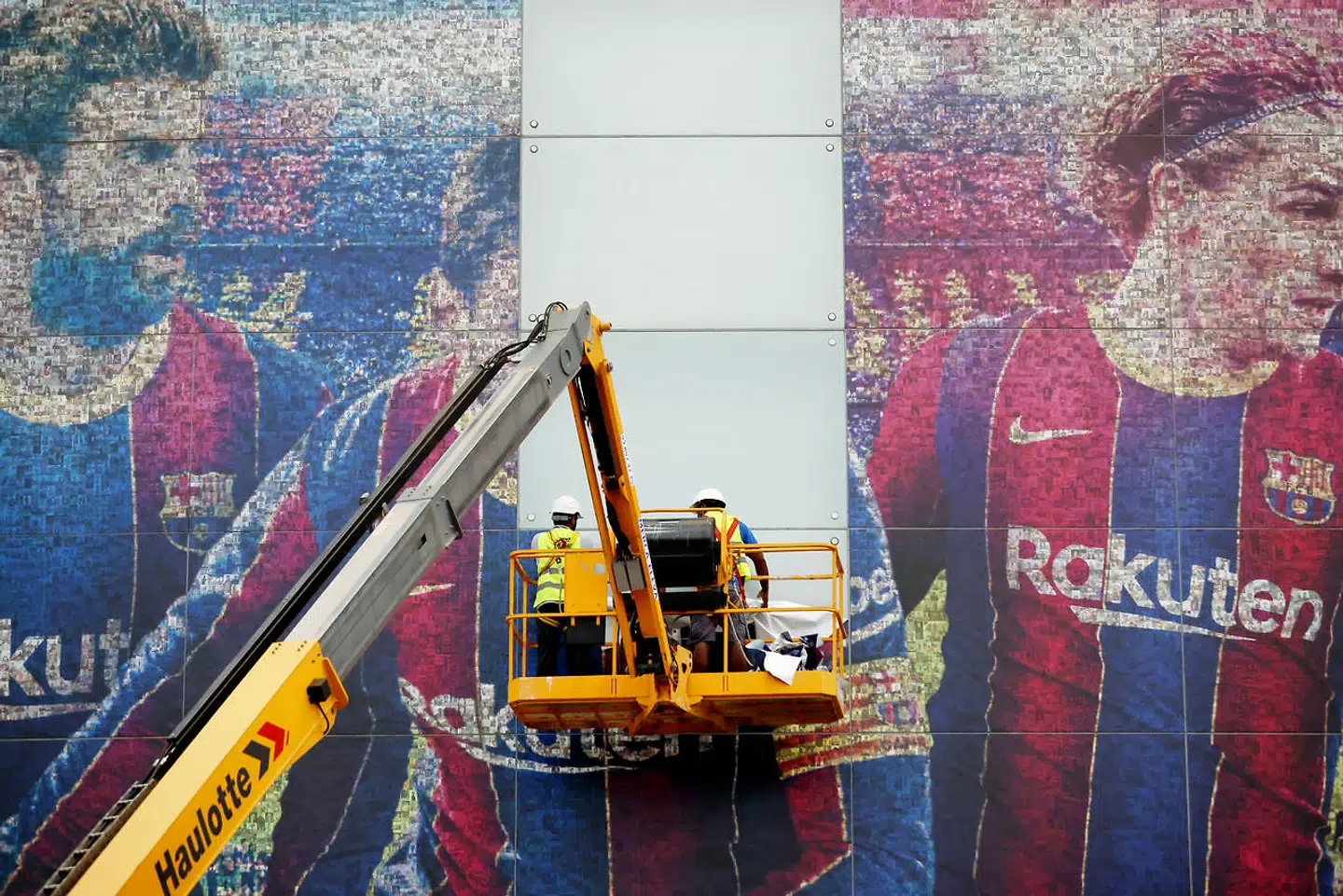 Soccer Football - Lionel Messi leaves FC Barcelona - Camp Nou, Barcelona, Spain - August 10, 2021 An image of Lionel Messi is seen being taken down outside the Camp Nou REUTERS/Nacho Doce