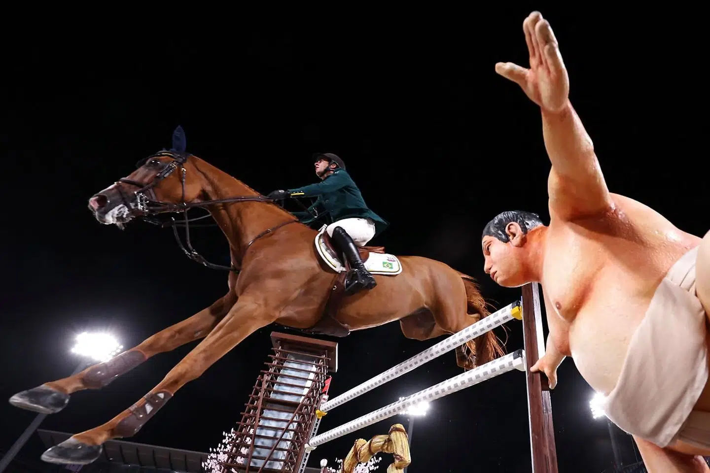 Brazil's Marlon Modolo Zanotelli riding Edgar M competes in the equestrian's jumping individual qualifying during the Tokyo 2020 Olympic Games at the Equestrian Park in Tokyo on August 3, 2021. (Photo by Behrouz MEHRI / AFP)
