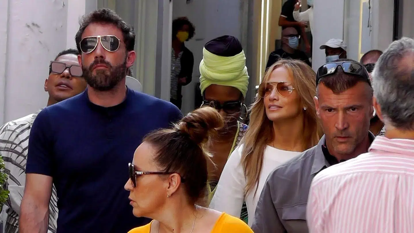 epa09373725 US singer/actress Jennifer Lopez (C-R) and US actor/director Ben Affleck (C-L) walk the streets of Capri, near Naples, Italy, 28 July 2021. The couple arrived on the island aboard the luxury yacht 'Valerie'. EPA/Giuseppe Catuogno