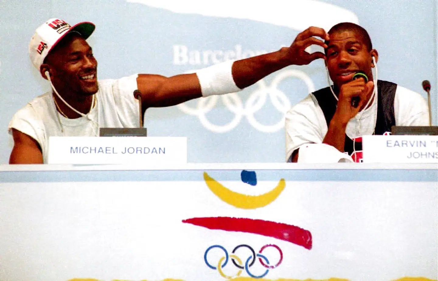Basketball stars Michael Jordan (L) and Earvin "Magic" Johnson clown for the media 25 July during a press conference for the U.S. Olympic "Dream Team." The team is strongly favored to win the gold.
