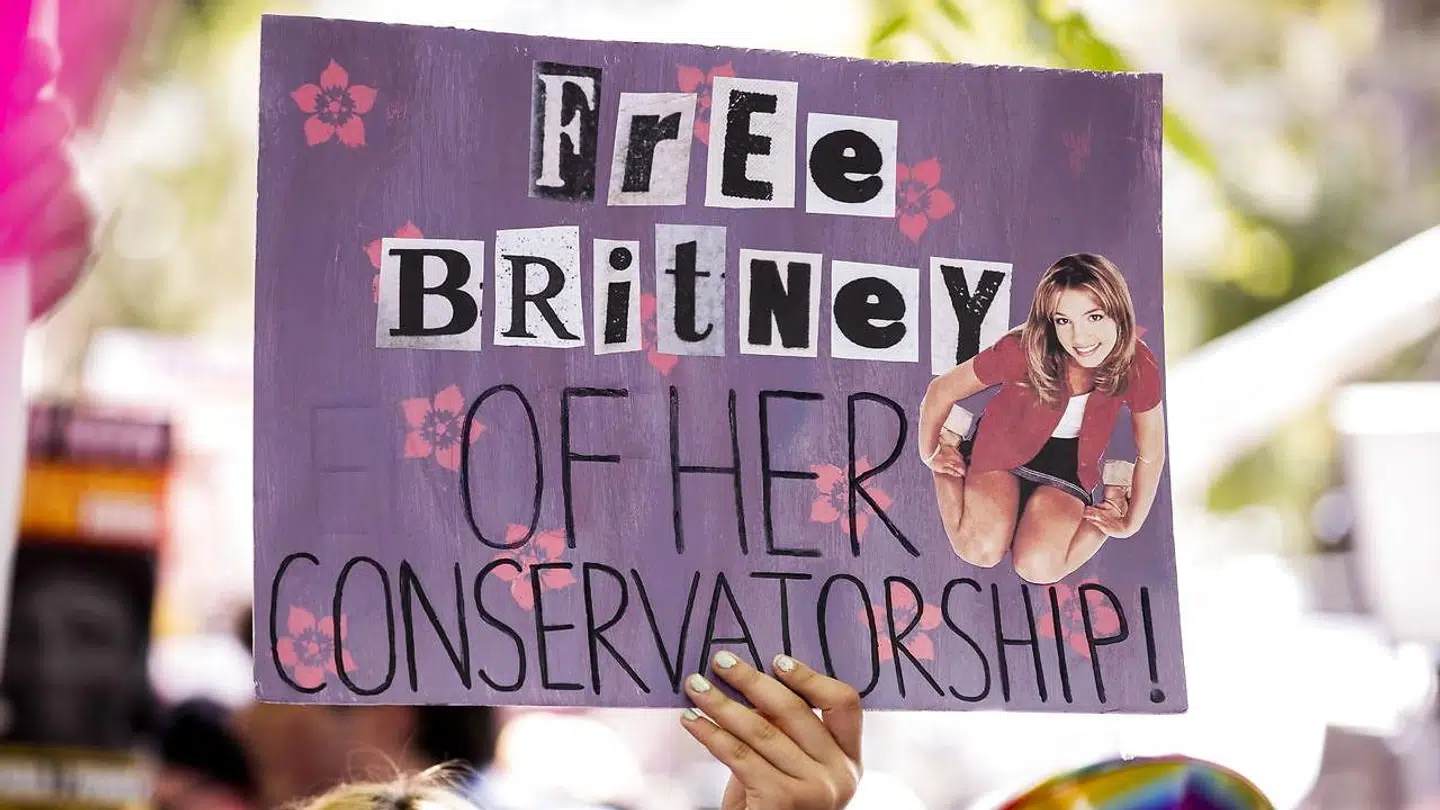 A demonstrator holds a poster reading 'Free Britney of her Conservatorship' during a #FREEBRITNEY protest in front of the court house where a hearing is scheduled in the Britney Spears' conservatorship case in Los Angeles, California, USA, 14 July 2021.