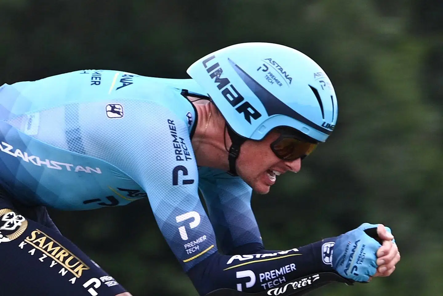 Team Astana's Jakob Diemer Fuglsang of Denmark rides during the 5th stage of the 108th edition of the Tour de France cycling race, a 27 km time trial between Change and Laval, on June 30, 2021. (Photo by Anne-Christine POUJOULAT / AFP)