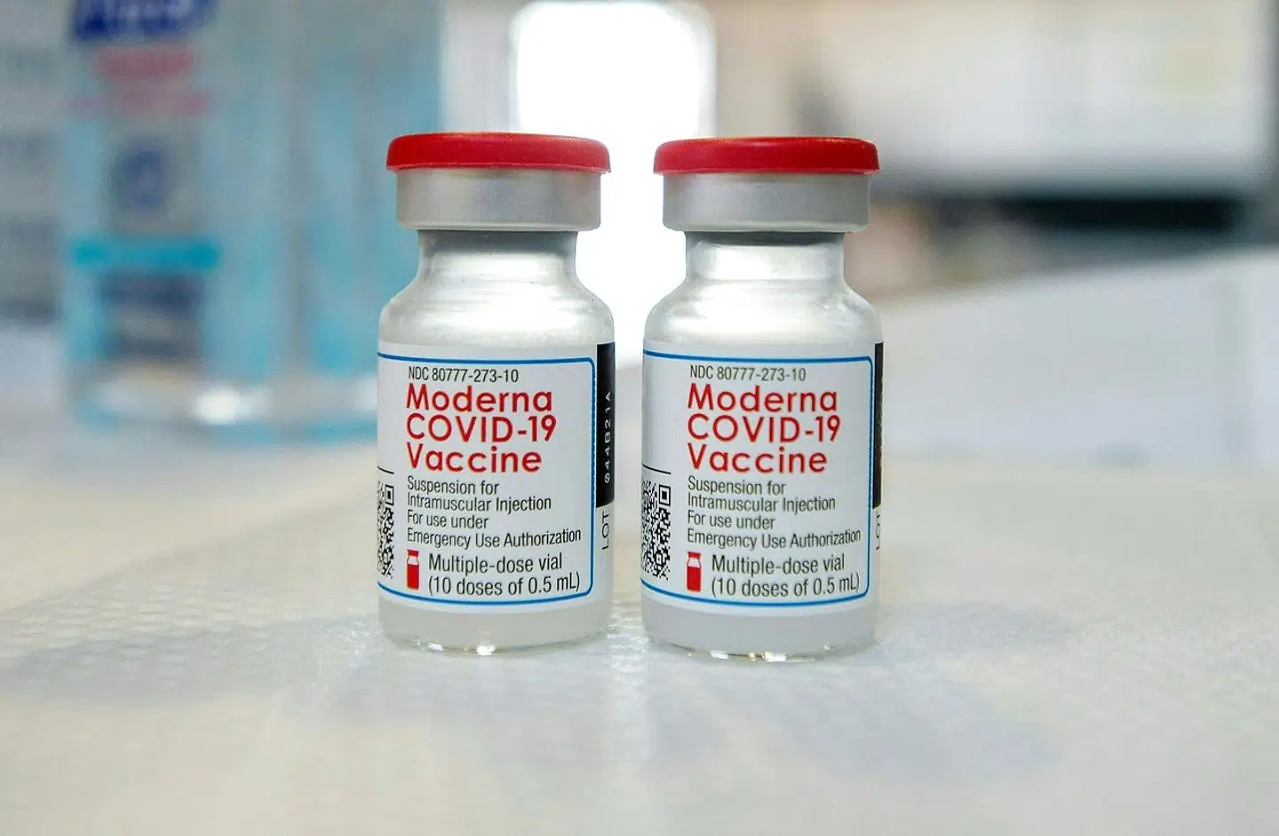 (FILES) In this file photo Moderna vials sit on a table before they are loaded into syringes at a mobile Covid-19 vaccination clinic, run by Hartford Healthcare at Saint Charles Borromeo Catholic Church's McGivney community center, in Bridgeport, Connecticut on April 20, 2021. - The United States has reached a deal to buy 200 million more doses of Moderna's Covid-19 vaccine, with the option to purchase variant-specific boosters that are in the pipeline, the biotech company said on June 16, 2021. The purchase brings Washington's confirmed order to 500 million doses of the two-shot regimen. (Photo by Joseph Prezioso / AFP)