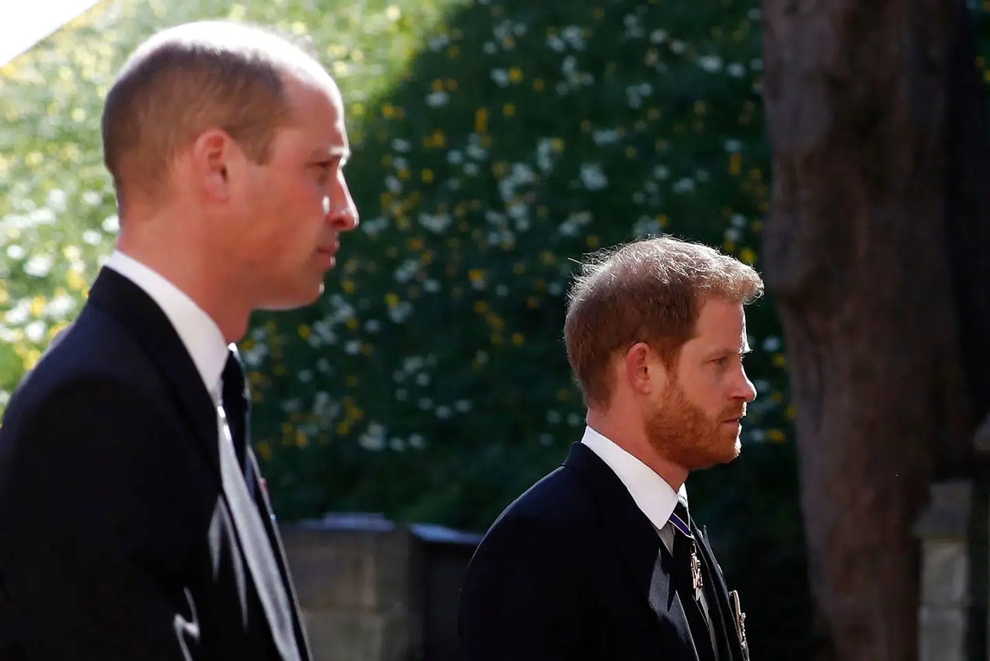 TOPSHOT - Britain's Prince William, Duke of Cambridge (L) and Britain's Prince Harry, Duke of Sussex follow the coffin during the ceremonial funeral procession of Britain's Prince Philip, Duke of Edinburgh to St George's Chapel in Windsor Castle in Windsor, west of London, on April 17, 2021. - Philip, who was married to Queen Elizabeth II for 73 years, died on April 9 aged 99 just weeks after a month-long stay in hospital for treatment to a heart condition and an infection. (Photo by Alastair Grant / various sources / AFP)