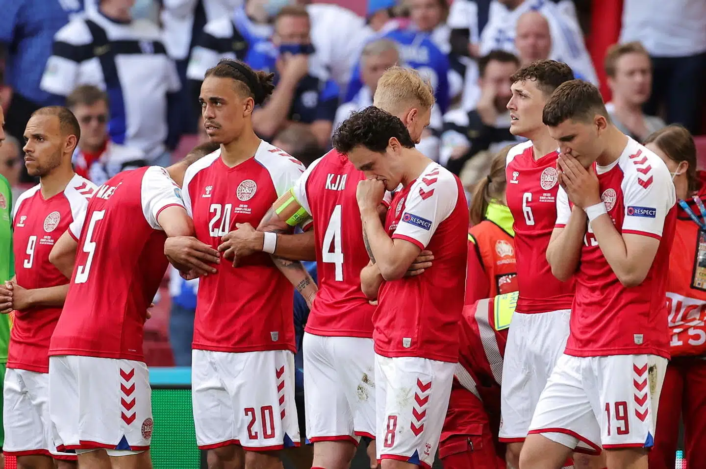 Soccer Football - Euro 2020 - Group B - Denmark v Finland - Parken Stadium, Copenhagen, Denmark - June 12, 2021 Denmark players react as Christian Eriksen receives medical attention after collapsing during the match Pool via REUTERS/Friedemann Vogel
