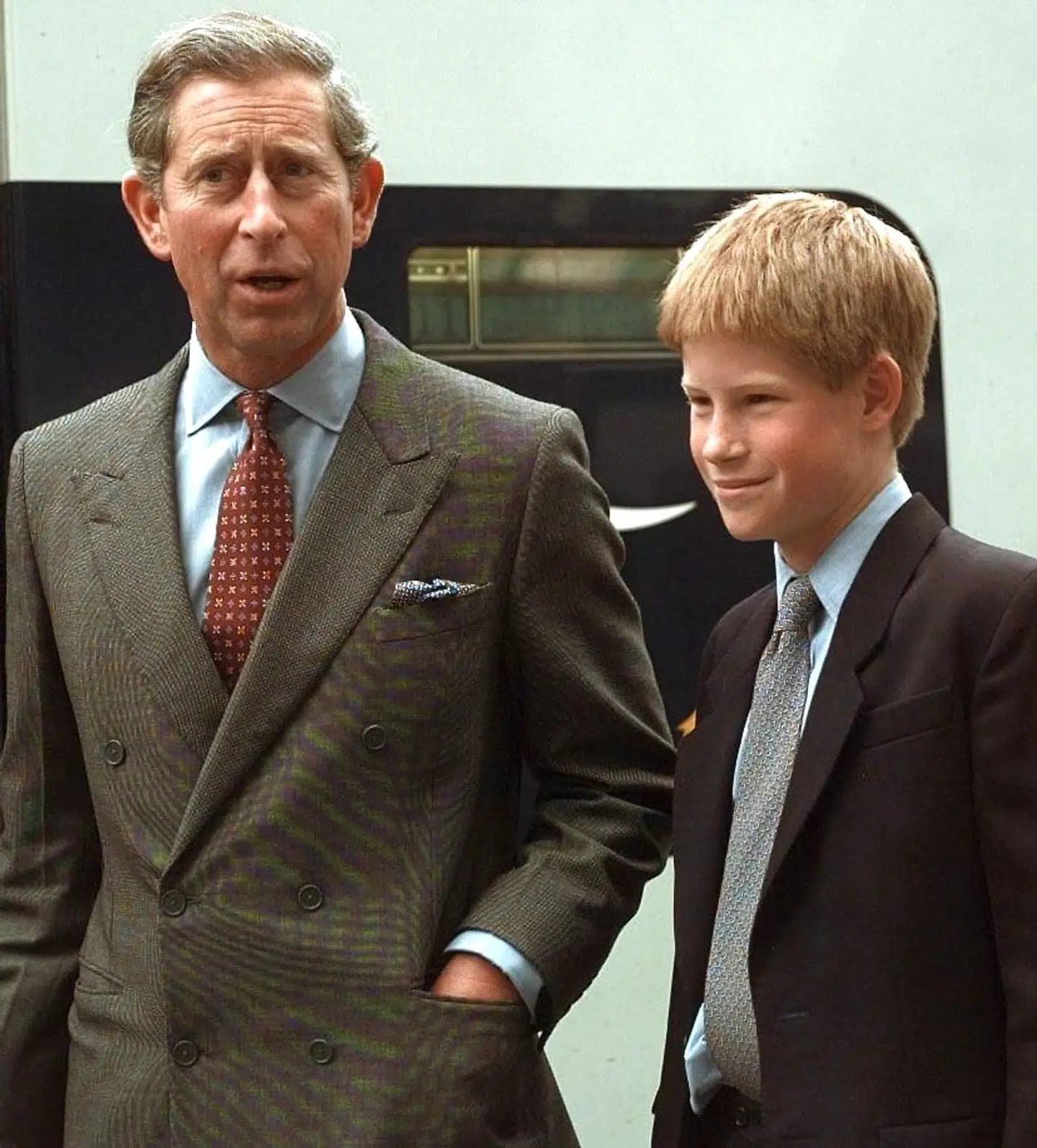 Britain's Prince Charles and son Prince Harry leave Waterloo Station on board Eurostar for France 26 June. The two Princes are due to watch the World Cup match England versus Colombia in Lens on Friday evening. / AFP PHOTO / JOHNNY EGGITT