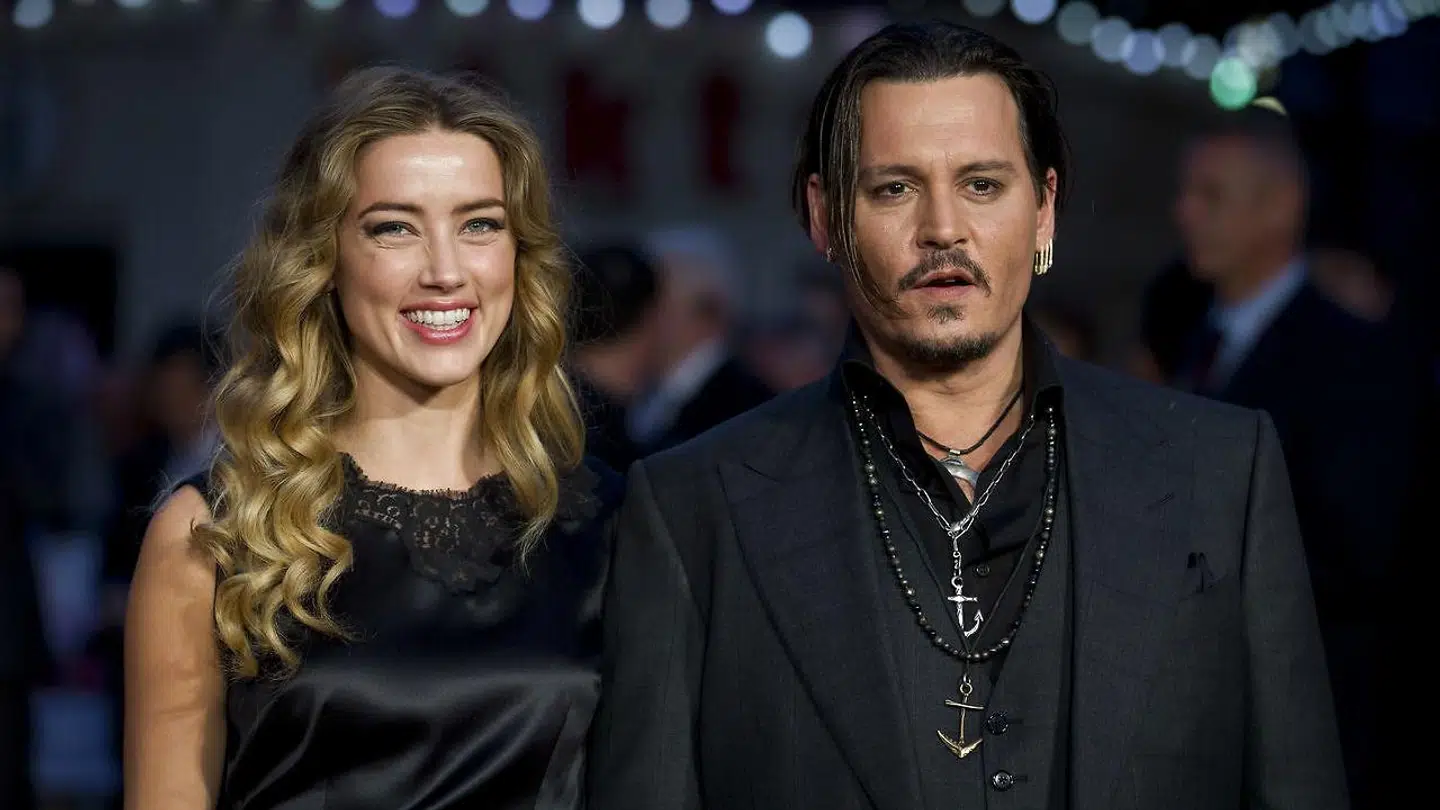 Arkivfoto af Amber Heard og Johnny Depp. (Photo by Justin TALLIS / AFP)