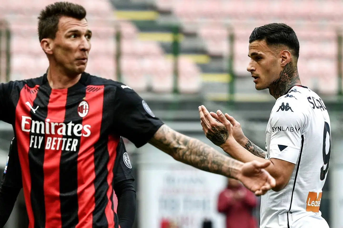 Genoa's Italian forward Gianluca Scamacca (R) reacts next to AC Milan's Croatrian forward Mario Mandzukic after scoring an own goal during the Italian Serie A football match AC Milan vs Genoa on April 18, 2021 at the San Siro stadium in Milan. (Photo by Filippo MONTEFORTE / AFP)