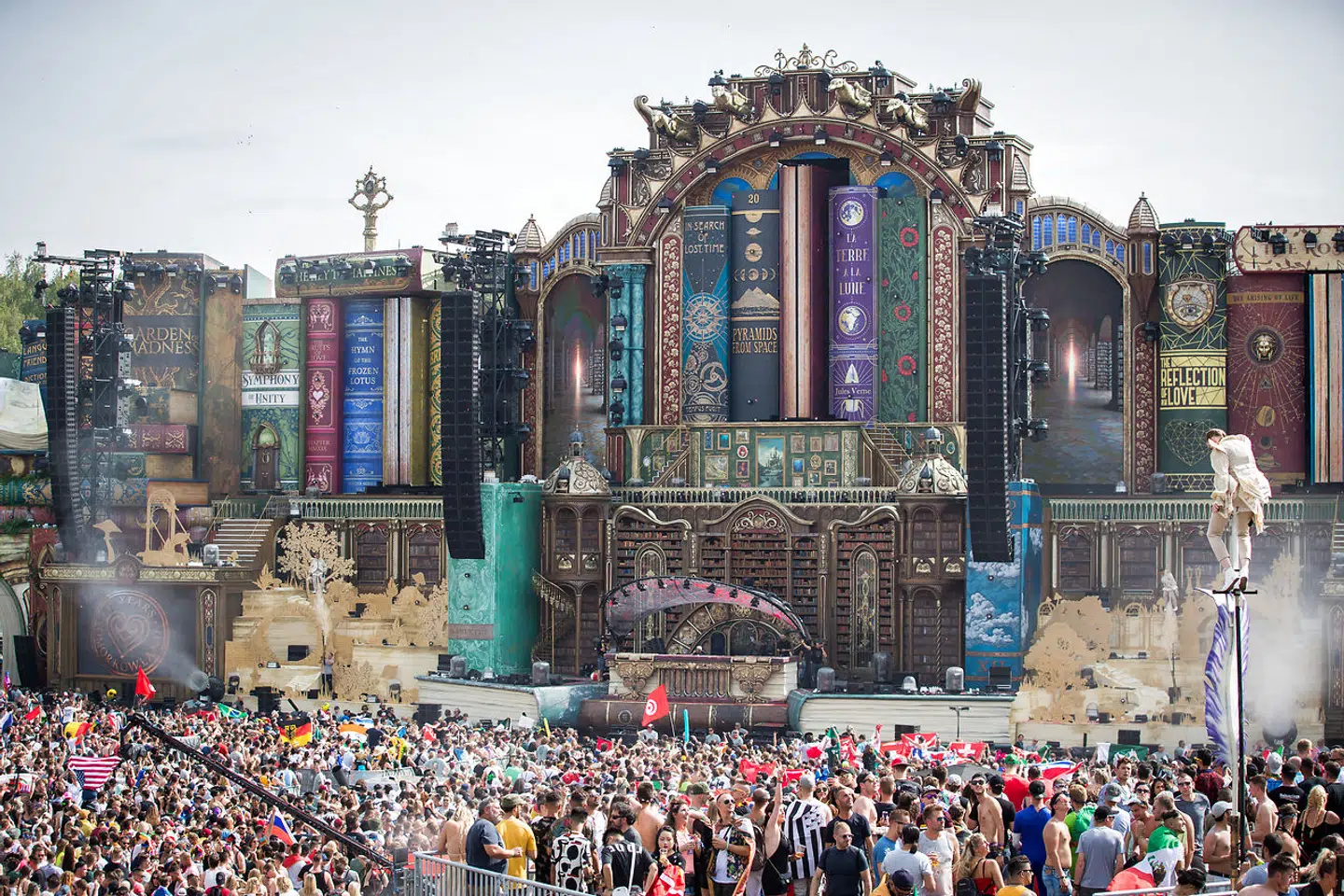 Revelers gather as a DJ performs at the main stage on the first day of the Tomorrowland music festival on July 19, 2019, in Boom. The 15th edition of Tomorrowland electronic music festival takes place at the 'De Schorre' terrain in Boom from 19 to 21 July 2019 and from 26 to 28 July 2019. DAVID PINTENS / BELGA / AFP