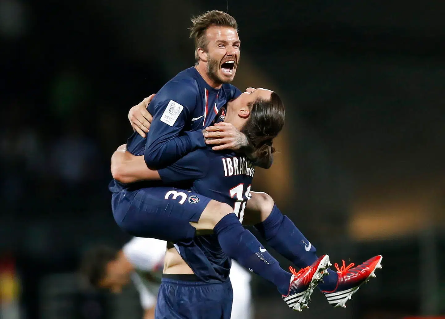 epa03920121 YEARENDER 2013 MAY David Beckham (L) and Zlatan Ibrahimovic (R) of Paris Saint Germain celebrate after their victory against Olympique Lyon in the French Ligue 1 soccer match at the Stade Gerland in Lyon, France, 12 May 2013. EPA/GUILLAUME HORCAJUELO