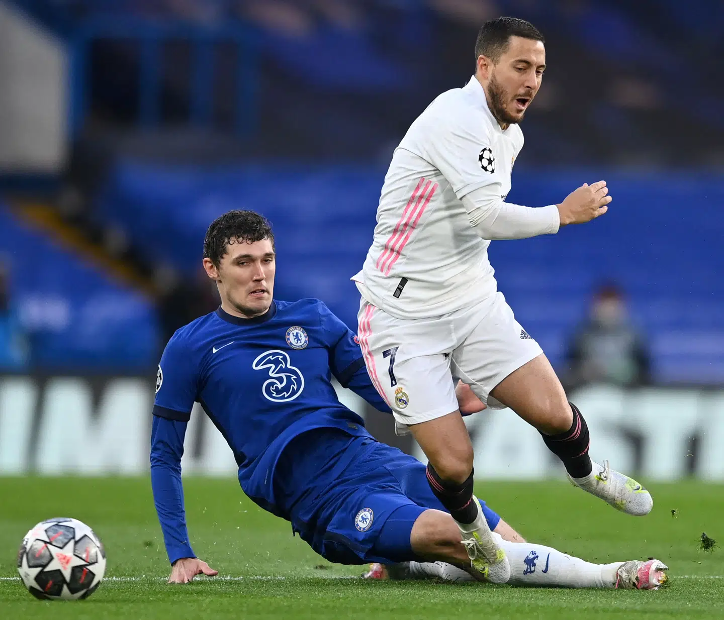 Chelsea's Danish defender Andreas Christensen (L) vies with Real Madrid's Belgian forward Eden Hazard during the UEFA Champions League second leg semi-final football match between Chelsea and Real Madrid at Stamford Bridge in London on May 5, 2021. (Photo by Glyn KIRK / AFP)
