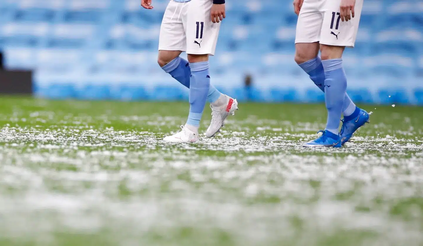 Soccer Football - Champions League - Semi Final Second Leg - Manchester City v Paris St Germain - Etihad Stadium, Manchester, Britain - May 4, 2021 General view of snow on the pitch as Manchester City players walk out before the match REUTERS/Phil Noble