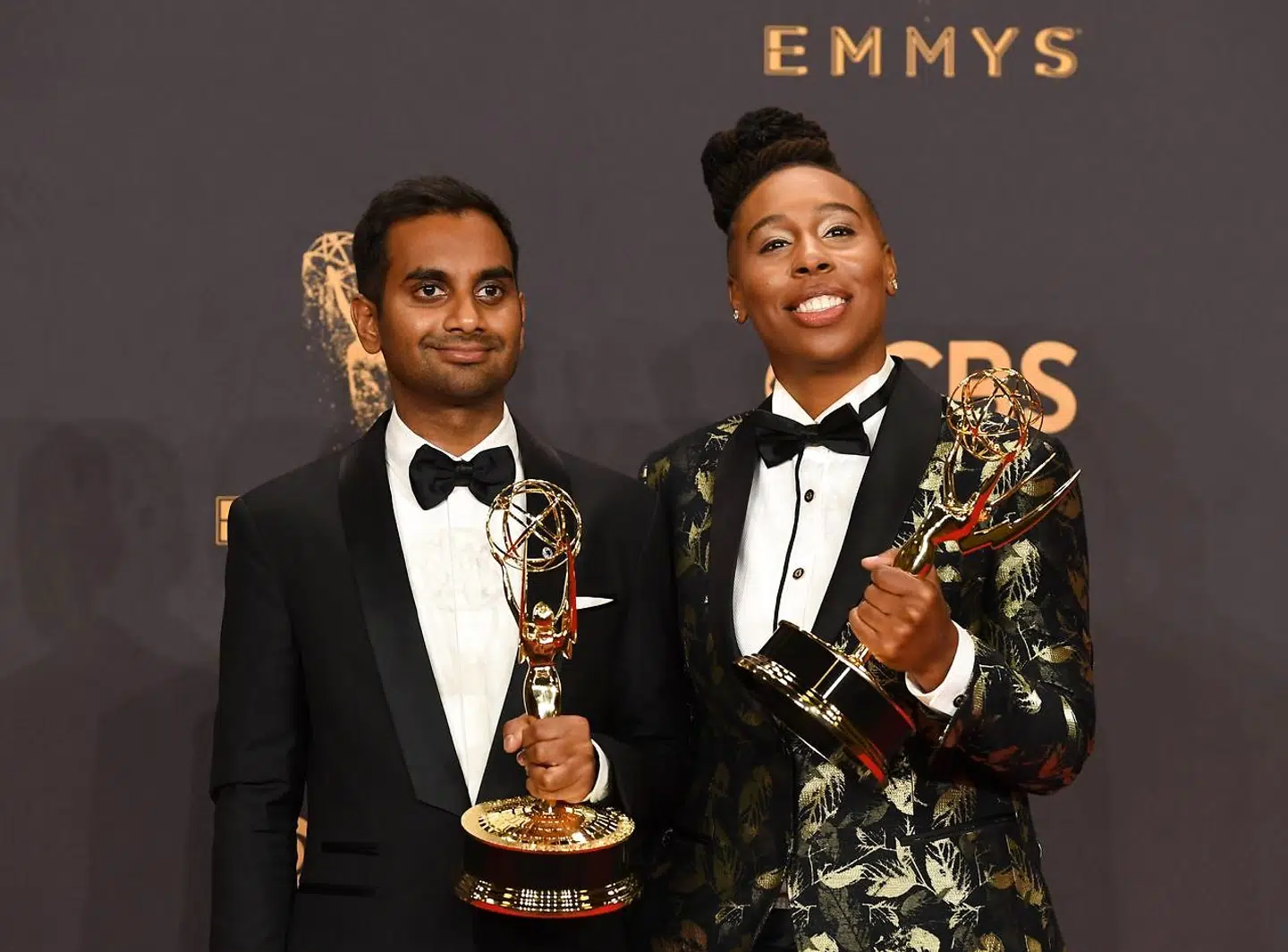 Aziz Ansari (L) and Lena Waithe pose with the award for Outstanding Writing for a Comedy Series for "Master of None" during the 69th Emmy Awards at the Microsoft Theatre on September 17, 2017 in Los Angeles, California. / AFP PHOTO / Mark RALSTON