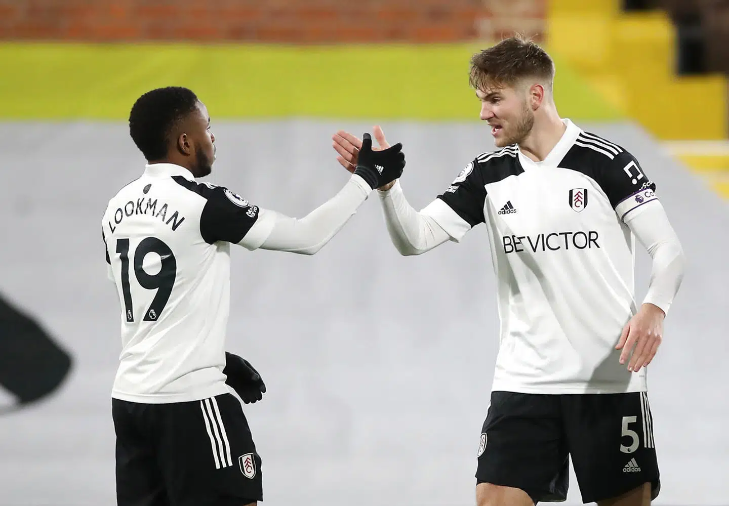 Soccer Football - Premier League - Fulham v Manchester United - Craven Cottage, London, Britain - January 20, 2021 Fulham's Ademola Lookman celebrates scoring their first goal with Joachim Andersen Pool via REUTERS/Peter Cziborra EDITORIAL USE ONLY.No use with unauthorized audio, video, data, fixture lists, club/league logos or 'live' services. Online in-match use limited to 75 images, no video emulation.No use in betting, games or single club /league/player publications. Please contact your account representative for further details.