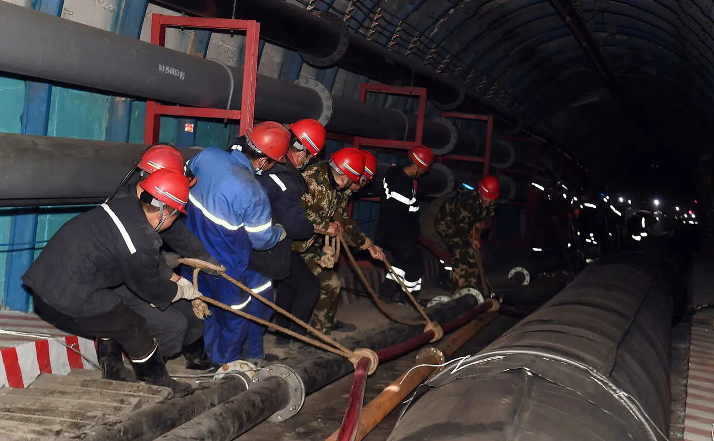 Rescuers work at the site where a coal mine flooded in Hutubi county, Xinjiang Uighur Autonomous Region, China April 11, 2021. China Daily via REUTERS ATTENTION EDITORS - THIS IMAGE WAS PROVIDED BY A THIRD PARTY. CHINA OUT.