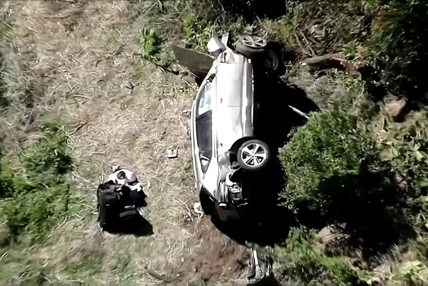 The vehicle of golfer Tiger Woods, who was rushed to hospital after suffering multiple injuries, lies on its side after being involved in a single-vehicle accident in Los Angeles, California, U.S. in a still image from video taken February 23, 2021. KNBC via REUTERS NO RESALES.NO ARCHIVES. MANDATORY CREDIT. THIS IMAGE HAS BEEN SUPPLIED BY A THIRD PARTY.