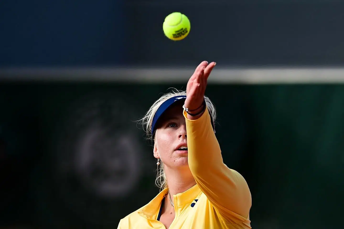 Denmark's Clara Tauson serves the ball to Danielle Collins of the US during their women's singles second round tennis match on Day 5 of The Roland Garros 2020 French Open tennis tournament in Paris on October 1, 2020. (Photo by MARTIN BUREAU / AFP)