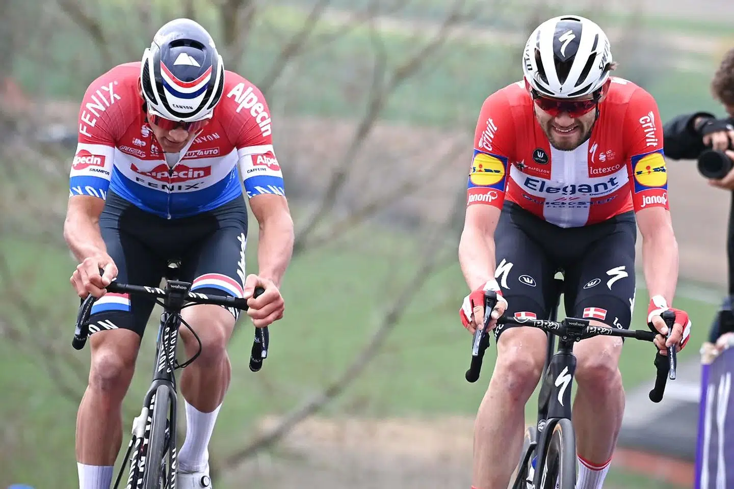Dutch Mathieu Van der Poel of Alpecin-Fenix and Danish Kasper Asgreen of Deceuninck-Quick-Step compete in the 105th edition of the "Ronde van Vlaanderen, Tour of Flanders" one day cycling race, from Antwerp to Oudenaarde, on April 4, 2021. (Photo by DAVID STOCKMAN / various sources / AFP) / Belgium OUT