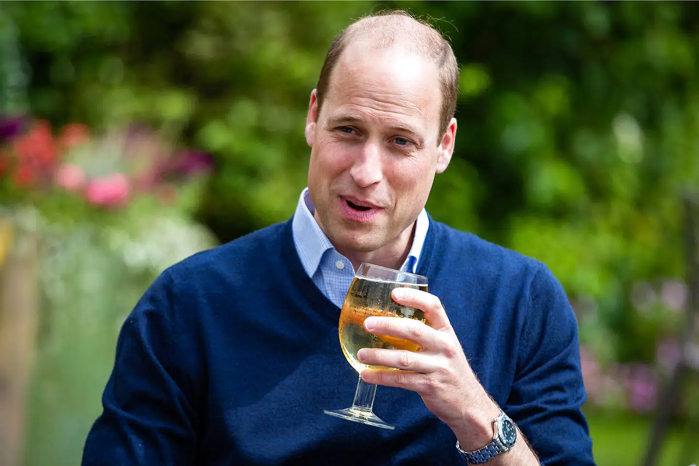 Britain's Prince William, Duke of Cambridge, gestures as he takes a sip of an Aspalls cider at The Rose and Crown pub in Snettisham in eastern England on July 3, 2020, as English pubs and restaurants prepare to reopen after their enforced closure due to the coronavirus pandemic. Aaron Chown / POOL / AFP