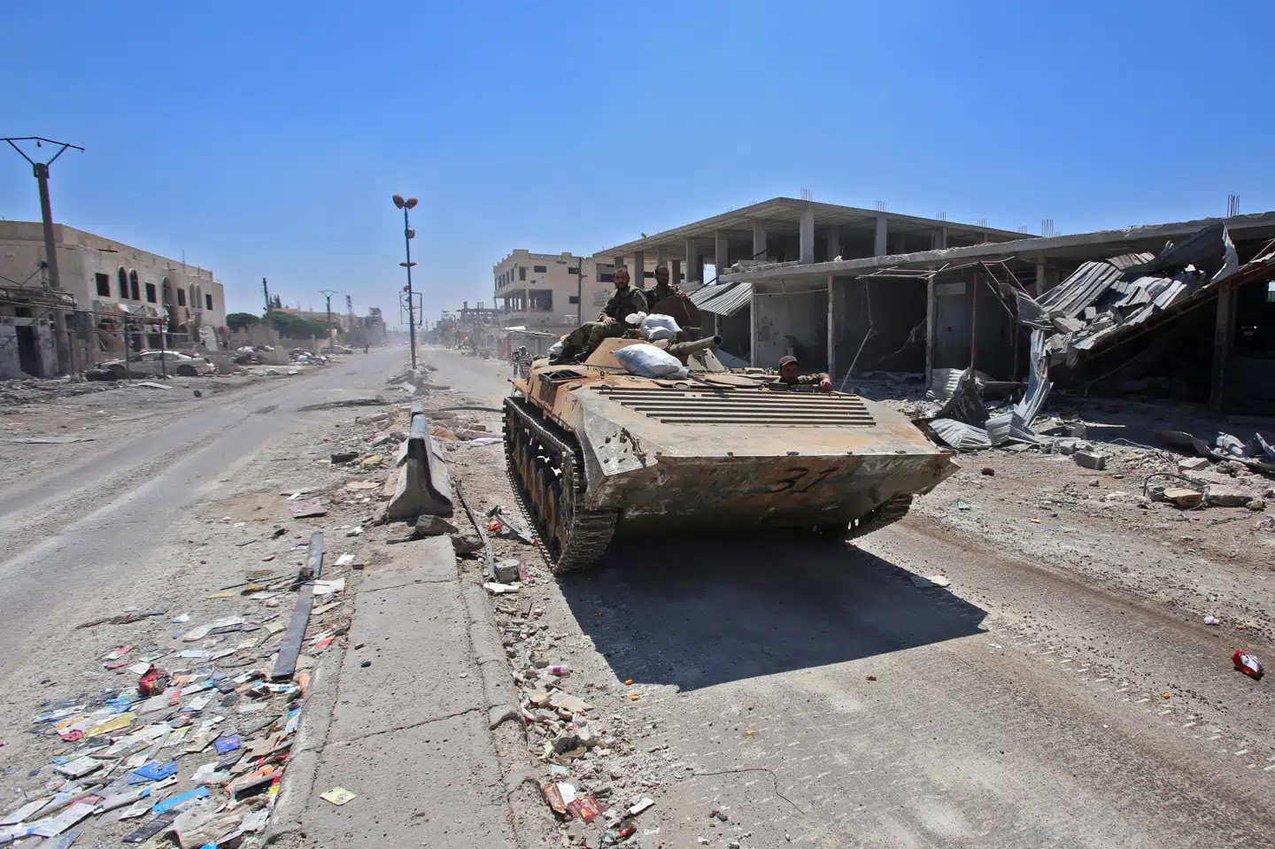 Her ses syriske regeringssoldater i landsbyen Saida i juli 2018. Youssef Karwashan/Ritzau Scanpix