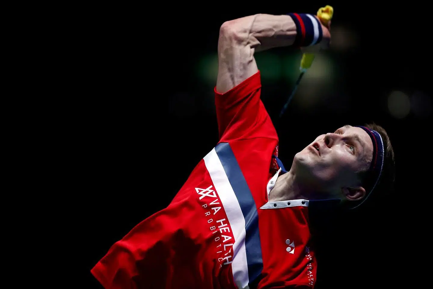 Denmark's Viktor Axelsen serves against Denmark's Anders Antonsen during their men's singles semi-final match on day four of the All England Open Badminton Championship at the Utilita Arena in Birmingham, central England, on March 20, 2021. (Photo by Adrian DENNIS / AFP)