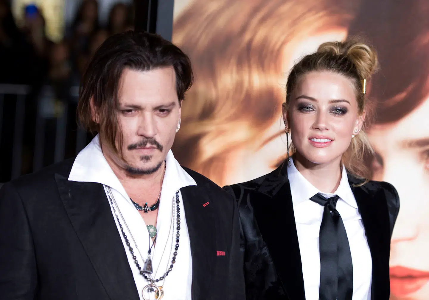 (FILES) In this file photo taken on November 22, 2015 Actors Johnny Depp (L) and Amber Heard attend the Los Angeles Premiere of "The Danish Girl", in Westwood, California, on November 21, 2015. - Hollywood star Johnny Depp on November 2, 2020 lost his libel lawsuit against British newspaper The Sun for branding him a "wife-beater" in a case that laid bare his chaotic lifestyle. Judge Andrew Nicol dismissed the 57-year-old's claim saying the newspaper group's article had been proven to be "substantially true", adding "the claimant has not succeeded in his action for libel". (Photo by Valerie MACON / AFP)