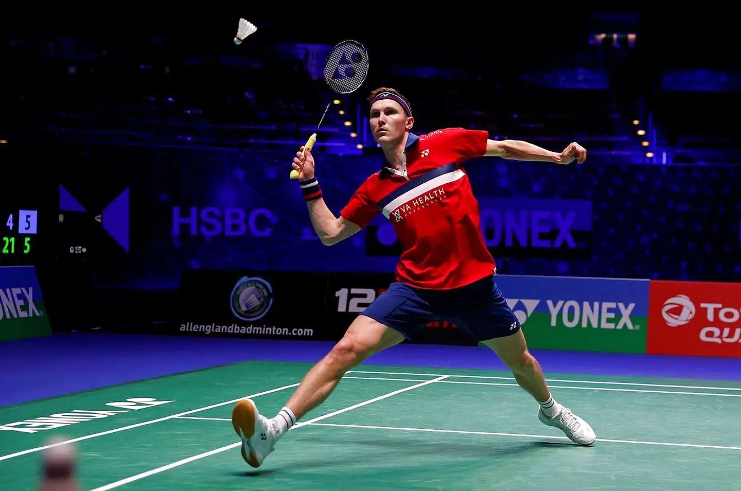 Denmark's Viktor Axelsen plays against Thailand's Sitthikom Thammasin during their men's singles quarter-final match on day three of the All England Open Badminton Championship, at the Utilita Arena in Birmingham, central England, on March 19, 2021. (Photo by Adrian DENNIS / AFP)