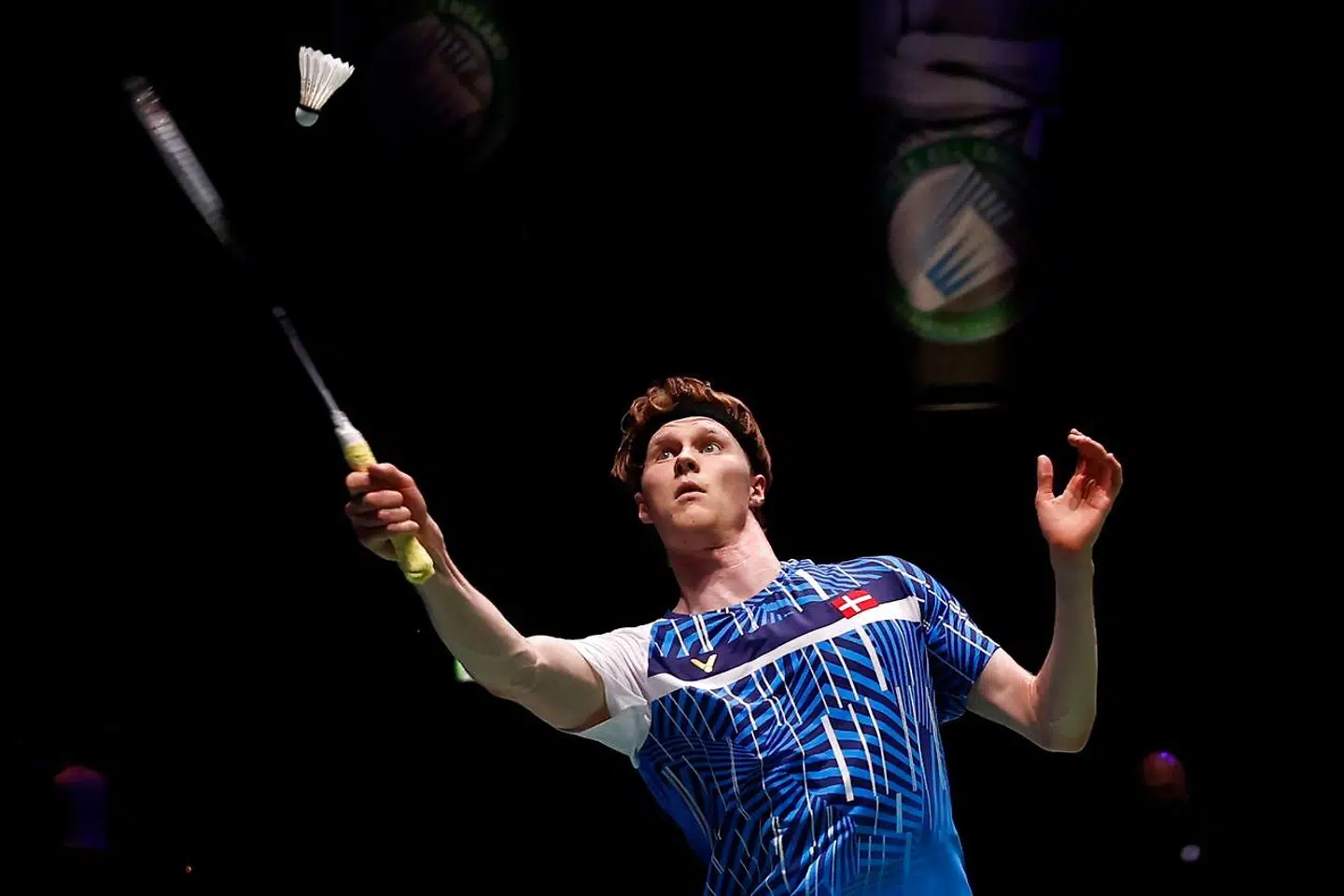 Denmark's Anders Antonsen returns to Japan's Kanta Tsuneyama on his way to victory during a men's singles quarter-final match on day three of the All England Open Badminton Championship, at the Utilita Arena in Birmingham, central England, on March 19, 2021. (Photo by Adrian DENNIS / AFP)