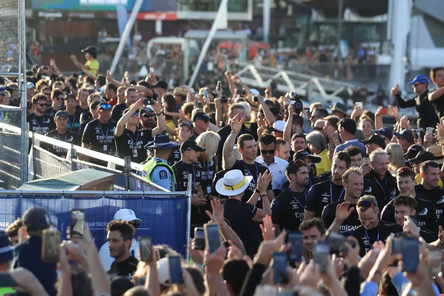 Team New Zealand crew members celebrate their victory of the 36th America's Cup against Luna Rossa Prada in Auckland on March 17, 2021. (Photo by Gilles Martin-Raget / AFP)