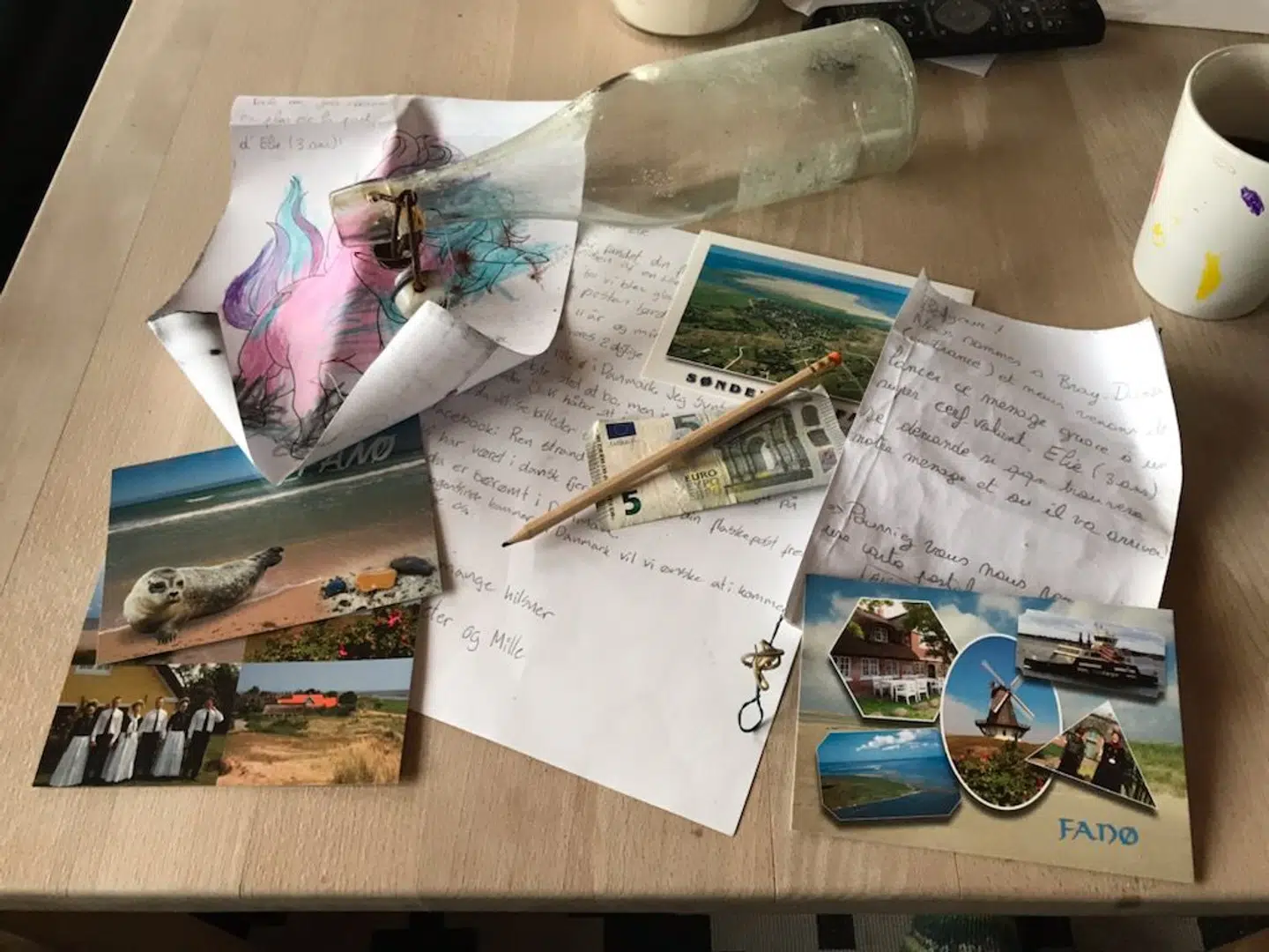 Her ses brevet og de postkort, som Peter Michelsen og datteren sender tilbage til Belgien