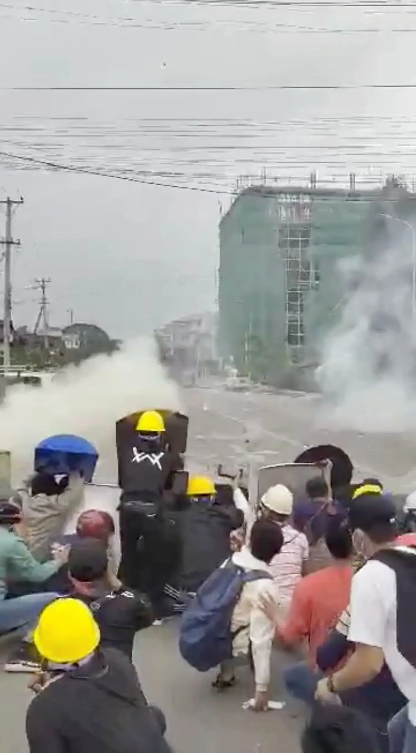 People clash with police during a protest in Myitkyina, Myanmar March 8, 2021 in this still image obtained by Reuters from a social media video. THIS IMAGE HAS BEEN SUPPLIED BY A THIRD PARTY.NO RESALES.NO ARCHIVES.