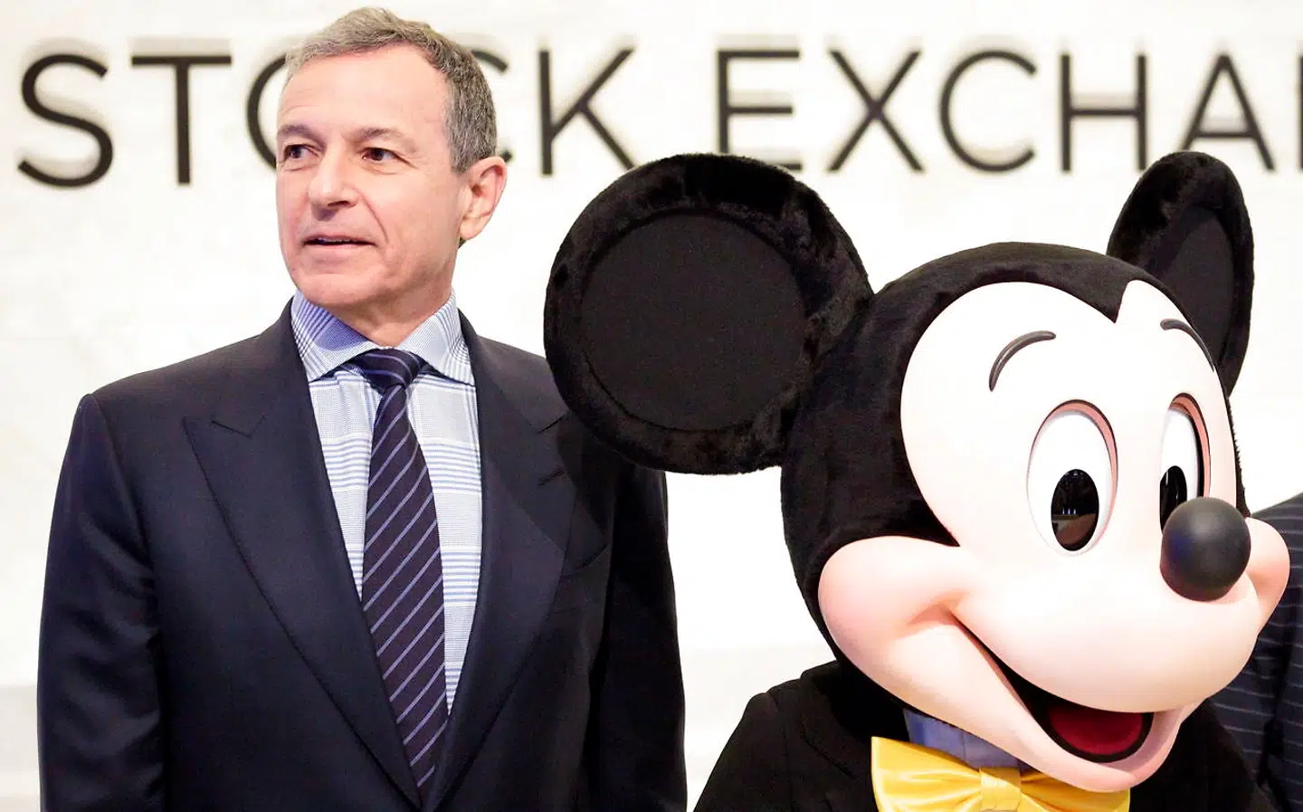 epa08247875 (FILE) - Bob Iger (L), the CEO of The Walt Disney Company, and company mascot Mickey Mouse stand together before ringing the opening bell of the New York Stock Exchange in New York, New York, USA, on 27 November 2017 (Reissued 25 February 2020). According to reports on 25 February 2020, Rober A. Iger is stepping down as Chief Executive Officer of The Walt Disney company after 15 years, and will be replaced Bob Chapek. Iger will become the executive chairman of Disney's board until his contract ends on 31 December 2021. EPA/JUSTIN LANE *** Local Caption *** 55574507