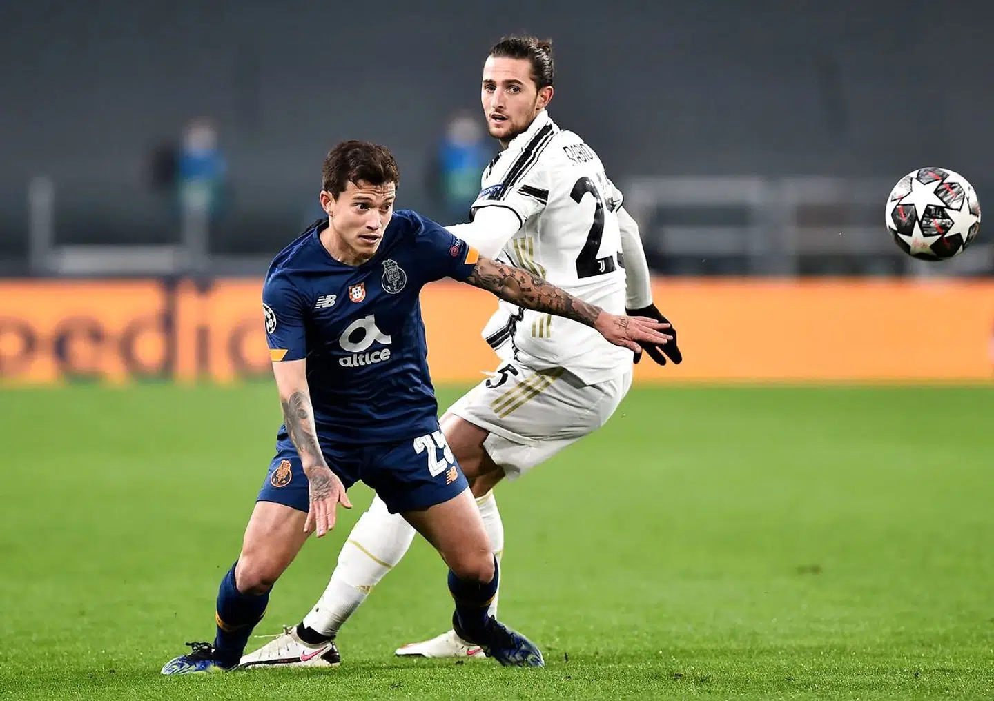 Soccer Football - Champions League - Round of 16 Second Leg - Juventus v FC Porto - Allianz Stadium, Turin, Italy - March 9, 2021 FC Porto's Otavio in action with Juventus' Adrien Rabiot REUTERS/Massimo Pinca