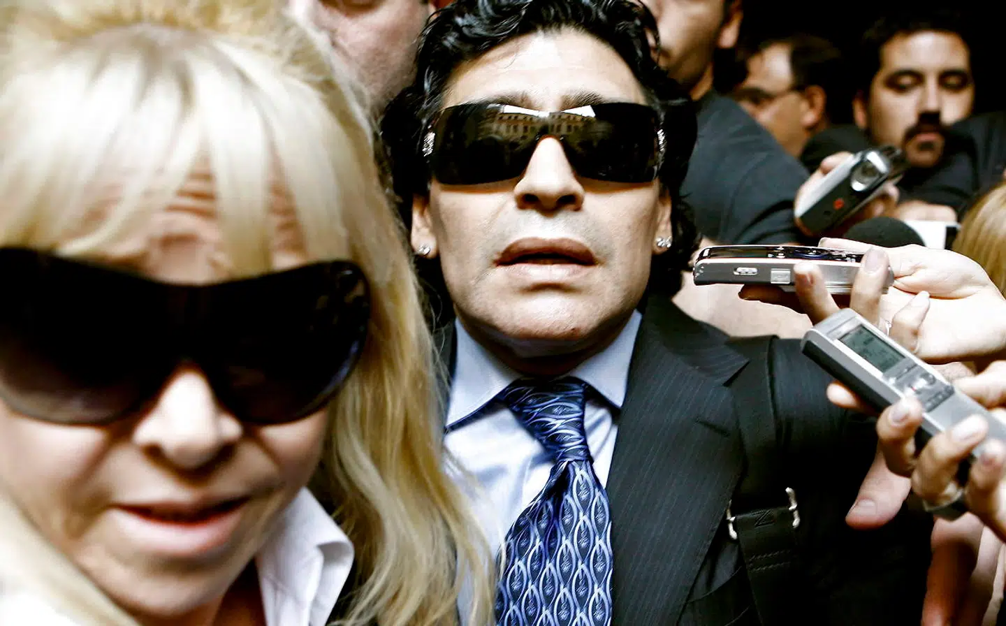 epa08841732 (FILE) - Argentinean soccer legend Diego Maradona (C) and his ex-wife Claudia Villafane (L) leave a court building in Buenos Aires, Argentina, 23 April 2008, where he attended a conciliation audience with former manager Guillermo Coppola (re-issued on 25 November 2020). Diego Maradona has died after a heart attack, media reports claimed on 25 November 2020. The Argentine soccer great was among the best players ever and who led his country to the 1986 World Cup title before later struggling with cocaine use and obesity. He was 60. EPA/LEO LA VALLE
