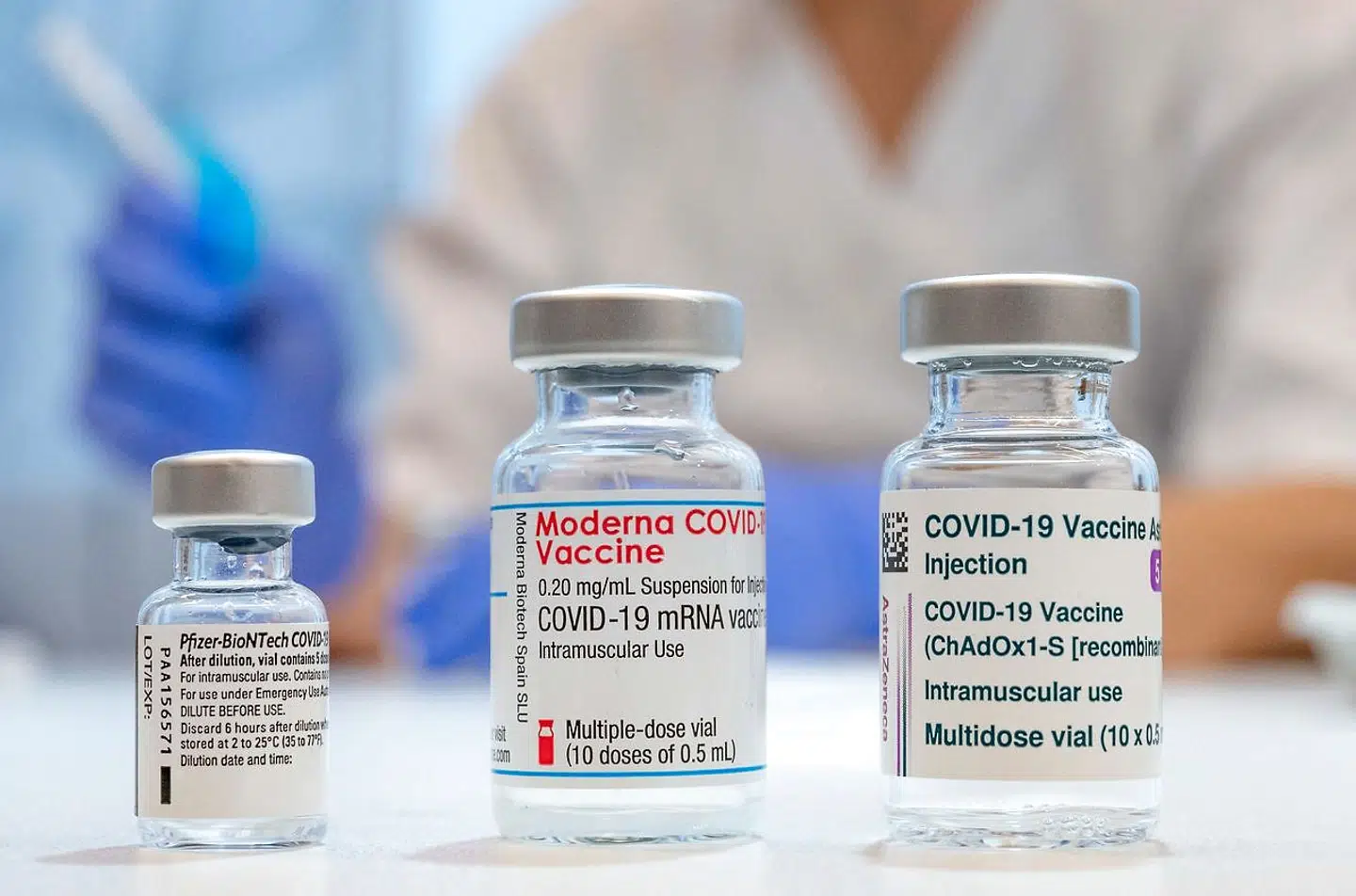 Used vaccine vials that contained (L-R) Pfizer-BioNTech, Moderna and AstraZeneca Covid-19 vaccines are pictured at the Skane University Hospital vaccination centre in Malmo, Sweden, on February 17, 2021. (Photo by Johan NILSSON / TT NEWS AGENCY / AFP) / Sweden OUT