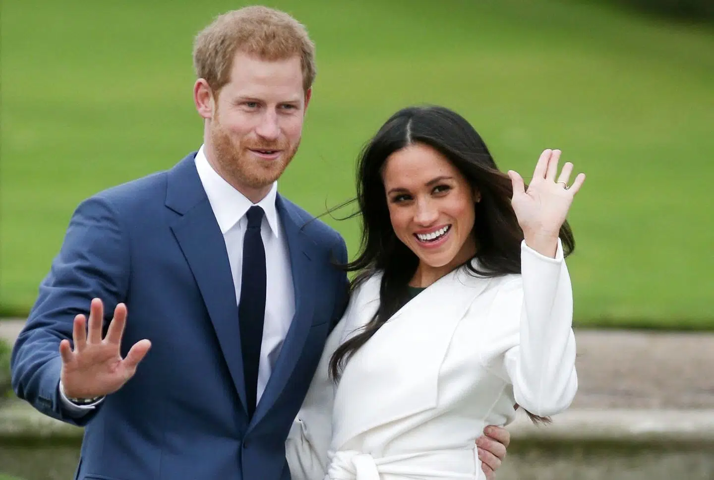 (FILES) In this file photo taken on November 27, 2017 Britain's Prince Harry and his fiancée US actress Meghan Markle pose for a photograph in the Sunken Garden at Kensington Palace in west London following the announcement of their engagement. - Meghan Markle has been "saddened" by reports published on Wednesday, March 3 that she faced a bullying complaint during her time at Kensington Palace and before she stepped back from royal duties, her spokesman said. (Photo by Daniel LEAL-OLIVAS / AFP)