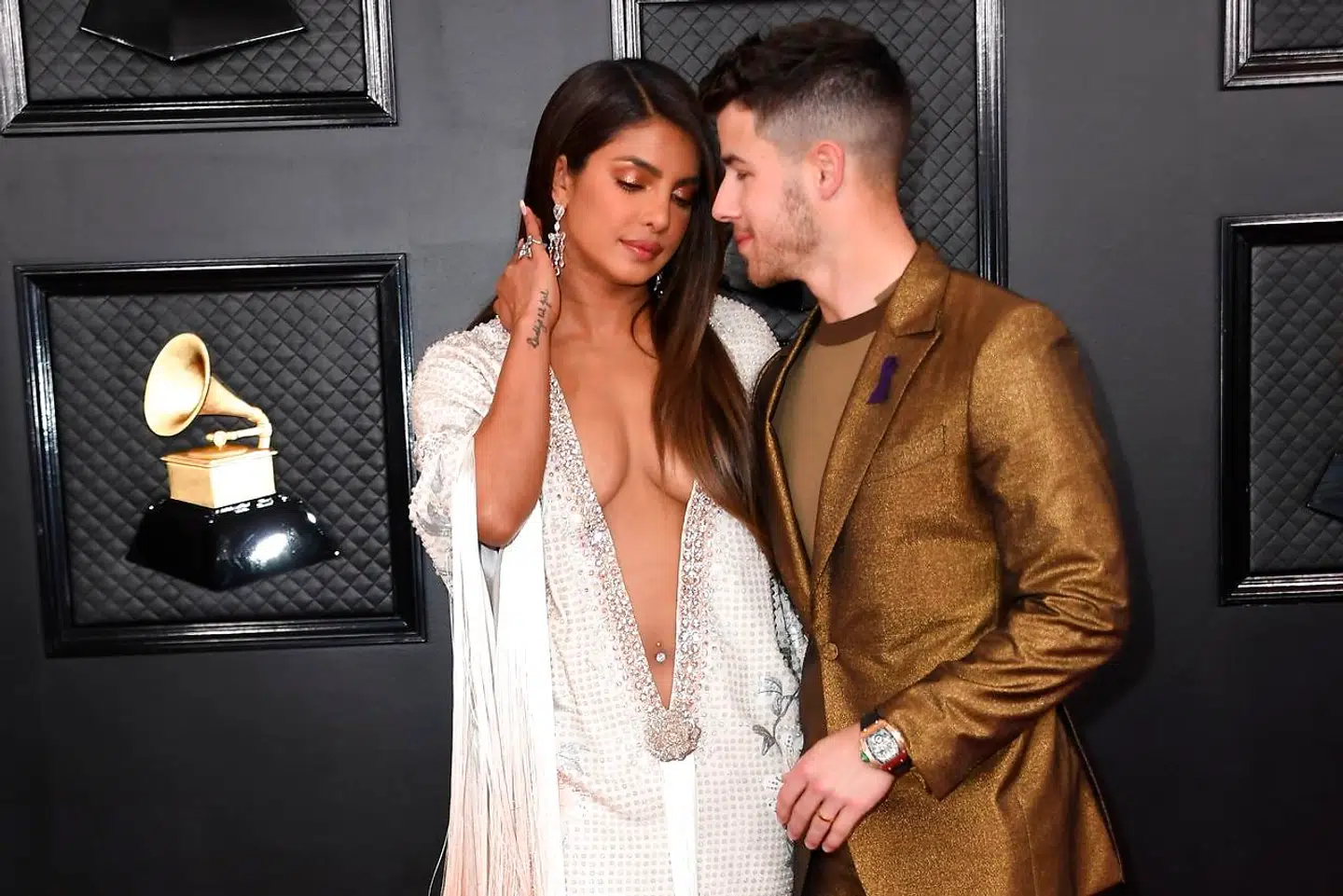 Indian actress Priyanka Chopra (L) and US singer-songwriter Nick Jonas arrive for the 62nd Annual Grammy Awards on January 26, 2020, in Los Angeles. (Photo by VALERIE MACON / AFP)