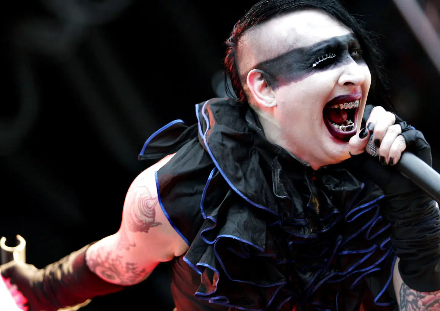 US rock singer Marilyn Manson performs 04 June 2005 during the open-air festival "Rock-am-Ring" on the Nuerburg Ring racetrack. Some 80 bands and some 60, 000 visitors are expected for 20th edition of this rock-festival. AFP PHOTO DDP/ THOMAS LOHNES GERMANY OUT
