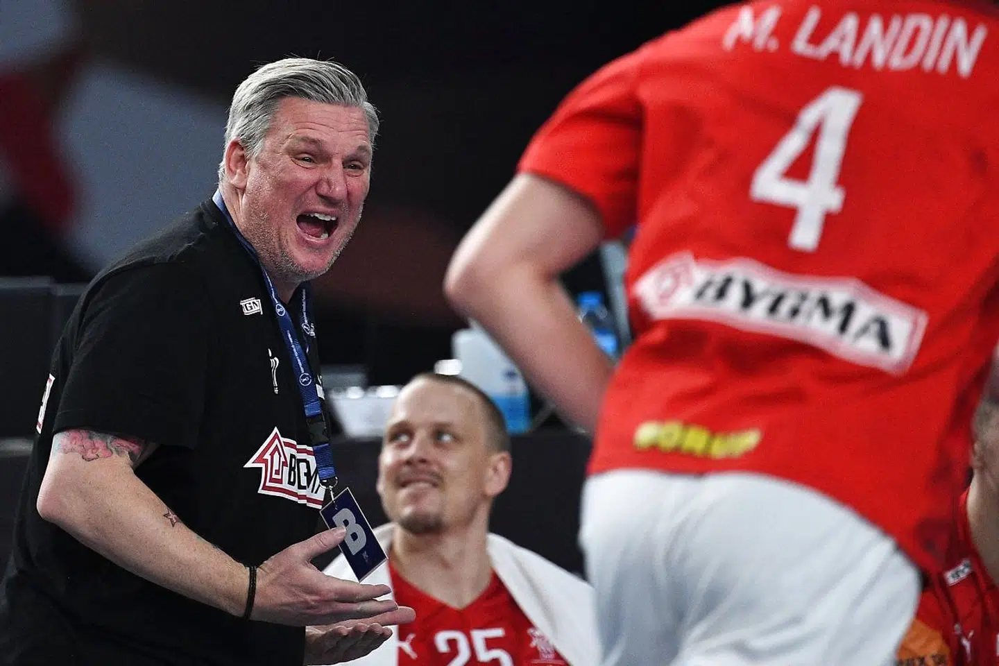 Denmark's coach Nikolaj Jacobsen celebrates during the 2021 World Men's Handball Championship final match between Denmark and Sweden at the Cairo Stadium Sports Hall in the Egyptian capital on January 31, 2021. (Photo by Anne-Christine POUJOULAT / AFP)