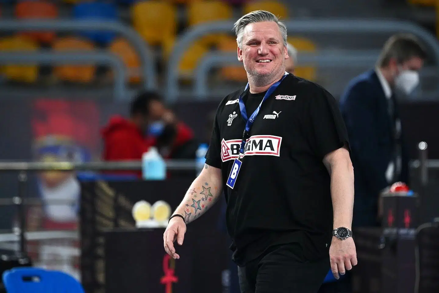 Denmark's coach Nikolaj Jacobsen smiles following his win in the 2021 World Men's Handball Championship semifinal match between Spain and Denmark at the Cairo Stadium Sports Hall in the Egyptian capital on January 29, 2021. (Photo by Anne-Christine POUJOULAT / AFP)