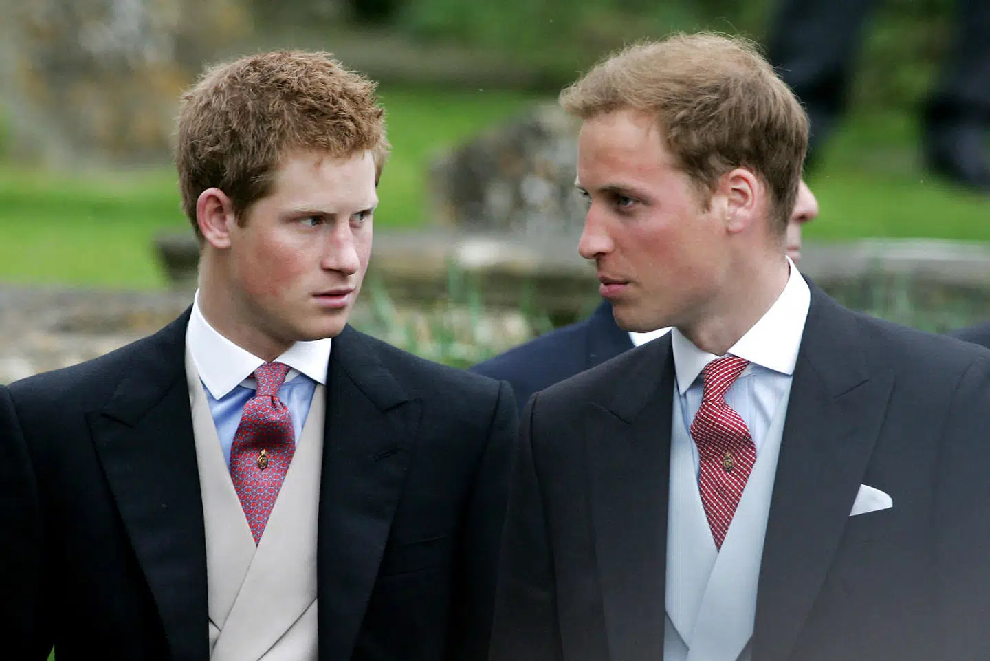 (FILES) In this file photo taken on May 06, 2006 Prince Harry (L), and Prince William (R) leave Lacock Cyraiax Church after the wedding of Laura Parker-Bowles, daughter of Camilla Parker-Bowles, Duchess of Cornwall, and Harry Lopes, 06 May 2006. - Prince Harry, who became the father of a "very healthy boy" on Monday, has transformed himself from an angry young man into one of the British royal family's greatest assets. (Photo by Carl DE SOUZA / AFP)