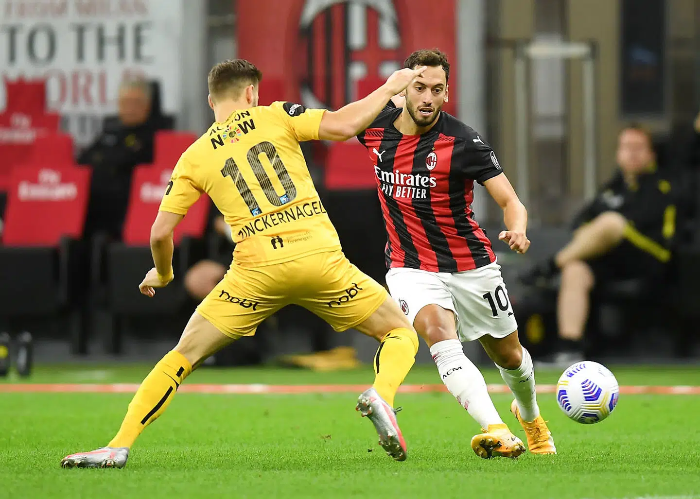 Soccer Football - Europa League - Third qualifying round - AC Milan v Bodo/Glimt - San Siro, Milan, Italy - September 24, 2020 AC Milan's Hakan Calhanoglu in action with Bodo/Glimt's Philip Zinckernagel REUTERS/Daniele Mascolo