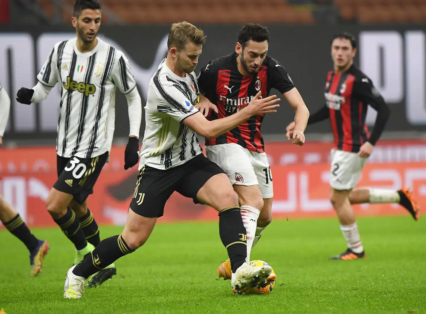 Soccer Football - Serie A - AC Milan v Juventus - San Siro, Milan, Italy - January 6, 2021 Juventus' Matthijs de Ligt in action with AC Milan's Hakan Calhanoglu REUTERS/Alberto Lingria